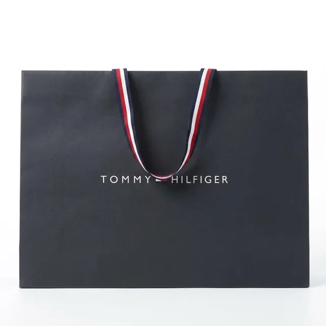 Фірмовий темно-синій паперовий пакет Tommy Hilfiger з білим логотипом та фірмовими смугастими стрічковими ручками 30×42×14.5 см
